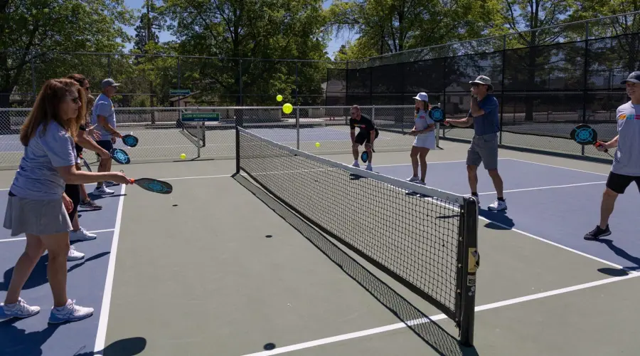 Beginner pickleball player learning proper stance at Mira Loma Park public courts in South Reno