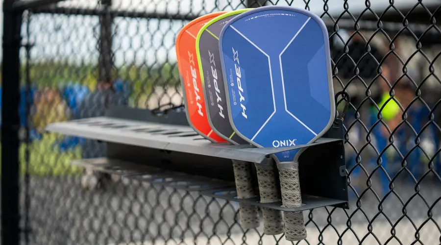 Paddle Rack rotation system at Reno Tennis Center showing paddles lined up for open play session